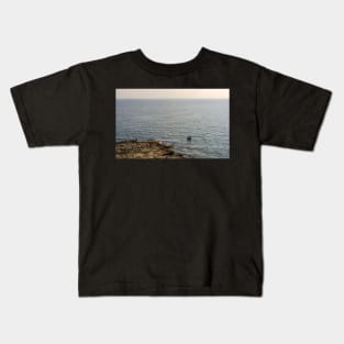 Lonely boat floating on the Mediterranean sea Kids T-Shirt